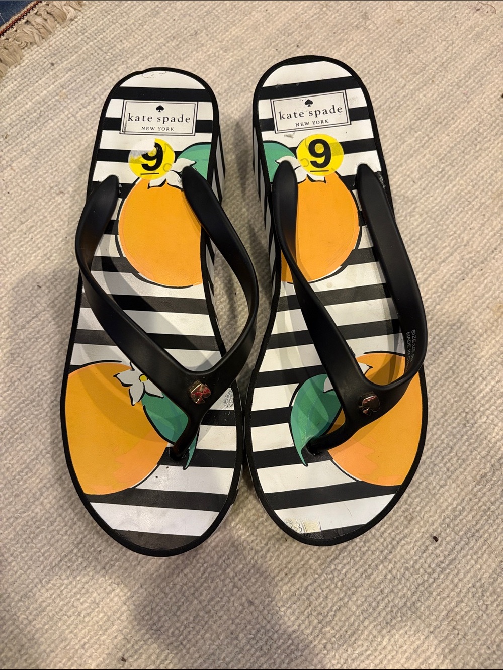 Kat’s Spade Women’s Orange Fruit Stripe Flip Flops - Black Straps